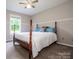 Inviting bedroom with a four-poster bed and a serene atmosphere at 2811 Saint James Church Rd, Denver, NC 28037