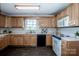 Traditional kitchen with white countertops, wooden cabinets and black appliances at 2811 Saint James Church Rd, Denver, NC 28037