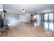 Spacious living room with hardwood floors, fireplace, and plenty of natural light at 2811 Saint James Church Rd, Denver, NC 28037