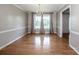 Spacious living room featuring hardwood floors, light gray walls and trim at 2811 Saint James Church Rd, Denver, NC 28037