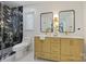 Modern bathroom with marble shower, double vanity and updated fixtures at 3103 Lauren Glen Rd, Charlotte, NC 28226
