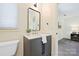 Bathroom vanity with neutral finishes, stone countertop and silver fixtures at 3103 Lauren Glen Rd, Charlotte, NC 28226