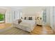 Bright bedroom with a large bed, hardwood floors, and updated decor at 3103 Lauren Glen Rd, Charlotte, NC 28226