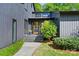 Close-up showcasing the striking wood door and modern design details of the home's facade at 3103 Lauren Glen Rd, Charlotte, NC 28226