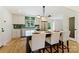 Updated kitchen featuring a stylish backsplash, stainless appliances, and eat-in island at 3103 Lauren Glen Rd, Charlotte, NC 28226