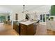 Modern kitchen with a marble island, updated range, and an open floor plan at 3103 Lauren Glen Rd, Charlotte, NC 28226