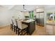 Bright eat-in kitchen featuring island seating and stainless steel appliances at 3103 Lauren Glen Rd, Charlotte, NC 28226