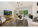 Inviting living room features high ceilings, modern light fixtures, and sliding glass doors to the outside at 3103 Lauren Glen Rd, Charlotte, NC 28226