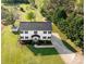 An aerial view of a beautiful home with a large yard, mature trees, and a long driveway at 311 Cooks Lake Rd, Gastonia, NC 28056
