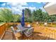 A spacious wooden deck with patio furniture offers an inviting outdoor space for relaxation and entertaining at 311 Cooks Lake Rd, Gastonia, NC 28056