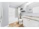 Bathroom features a vanity with granite countertop, open shelving, and combination shower/tub at 311 Cooks Lake Rd, Gastonia, NC 28056