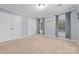 Bedroom featuring neutral paint and carpet, two windows, and two closets at 311 Cooks Lake Rd, Gastonia, NC 28056
