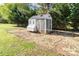 A charming chicken coop adds character to the property and provides a functional space for raising poultry at 311 Cooks Lake Rd, Gastonia, NC 28056