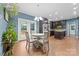 Bright eat-in kitchen boasts modern appliances, dark cabinetry, and access to the deck at 311 Cooks Lake Rd, Gastonia, NC 28056