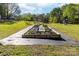 A well-tended garden offers opportunities for cultivating fresh produce and enjoying outdoor activities at 311 Cooks Lake Rd, Gastonia, NC 28056