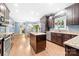 Open concept kitchen boasts granite countertops, stainless steel appliances, and a center island at 311 Cooks Lake Rd, Gastonia, NC 28056