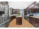Spacious kitchen features granite countertops, stainless steel appliances, and a large center island at 311 Cooks Lake Rd, Gastonia, NC 28056