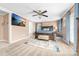 Comfortable main bedroom featuring a ceiling fan, mounted television, and stylish decor at 311 Cooks Lake Rd, Gastonia, NC 28056