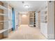 Spacious walk-in closet with custom shelving and ample storage space at 311 Cooks Lake Rd, Gastonia, NC 28056