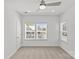 Spacious bedroom with neutral carpet, ceiling fan, and ample natural light at 4004 Crooked Spruce Ct, Matthews, NC 28105