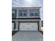 Beautiful two-car garage with modern trim and hardware at 4004 Crooked Spruce Ct, Matthews, NC 28105