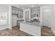 Stylish kitchen with granite countertops, stainless steel appliances, and sleek gray cabinetry at 4004 Crooked Spruce Ct, Matthews, NC 28105