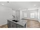Bright kitchen featuring granite countertops, stainless sink and fixture and open layout to the living room at 4004 Crooked Spruce Ct, Matthews, NC 28105