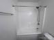 Bathroom shows a shower and tub combination with silver showerhead, white tile surround and tiled walls at 405 N Wilson St # 101, Rock Hill, SC 29730