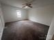 Carpeted bedroom includes ceiling fan and a window at 405 N Wilson St # 101, Rock Hill, SC 29730