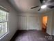 Bright bedroom with two closets, plush carpet, and a large window at 405 N Wilson St # 101, Rock Hill, SC 29730