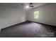 Carpeted bedroom offering natural light from window and overhead fan at 405 N Wilson St # 101, Rock Hill, SC 29730