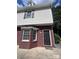 Close-up of the brick and siding exterior highlighting the front entrance of the property at 405 N Wilson St # 101, Rock Hill, SC 29730