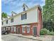 Charming townhome featuring brick and siding exterior with dormer windows and well-maintained landscaping at 405 N Wilson St # 101, Rock Hill, SC 29730