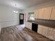 Well-appointed kitchen with white cabinets, granite countertops, and stainless steel appliances at 405 N Wilson St # 101, Rock Hill, SC 29730