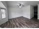 Bright living room showcasing gray flooring, crisp white walls, and contemporary ceiling fan at 405 N Wilson St # 101, Rock Hill, SC 29730