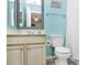 Bright bathroom with a vanity, framed mirror, toilet, towel rack, and shower curtain at 4086 Buckingham Dr, Fort Mill, SC 29707
