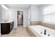Spacious bathroom with a walk-in closet, soaker tub, and vanity at 4086 Buckingham Dr, Fort Mill, SC 29707