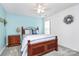 Cozy bedroom with a ceiling fan, neutral carpet, and ample natural light from the window at 4086 Buckingham Dr, Fort Mill, SC 29707
