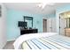 Bedroom featuring a stylish dresser, ceiling fan, and a view into the en suite bathroom at 4086 Buckingham Dr, Fort Mill, SC 29707