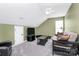 Bonus room featuring neutral carpeting, a futon, a TV, and a ceiling fan at 4086 Buckingham Dr, Fort Mill, SC 29707