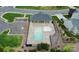 Aerial view of the community pool and clubhouse, featuring ample seating and parking in a well-maintained area at 4086 Buckingham Dr, Fort Mill, SC 29707