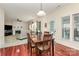 Dining area featuring wood table and chairs, with open access to living room and backyard at 4086 Buckingham Dr, Fort Mill, SC 29707