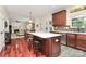 Open-concept kitchen featuring cherry cabinets, white countertops, and a large center island at 4086 Buckingham Dr, Fort Mill, SC 29707