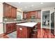 Well-lit kitchen with white countertops, cherry cabinets, and stainless steel appliances at 4086 Buckingham Dr, Fort Mill, SC 29707
