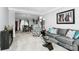 Comfortable living room with neutral color scheme, modern furnishings, and open access to the dining area at 4086 Buckingham Dr, Fort Mill, SC 29707