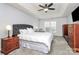Spacious main bedroom featuring a tray ceiling, ceiling fan, and neutral carpeting at 4086 Buckingham Dr, Fort Mill, SC 29707