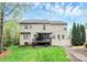 Rear exterior of the home with a large back yard and covered deck at 4086 Buckingham Dr, Fort Mill, SC 29707