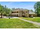 Spacious backyard features a gorgeous in-ground pool with an outdoor kitchen and luxurious landscaping at 5001 Oxfordshire Rd, Waxhaw, NC 28173