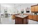 Spacious kitchen features granite countertops, a center island, and a breakfast nook with natural light at 5001 Oxfordshire Rd, Waxhaw, NC 28173