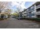 Well-maintained apartment complex exterior with ample parking at 501 Olmsted Park Pl # N, Charlotte, NC 28203